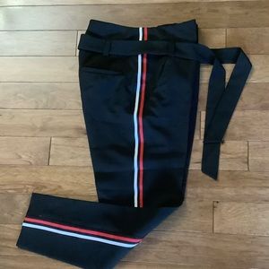 Black slacks with white and red strip on leg side